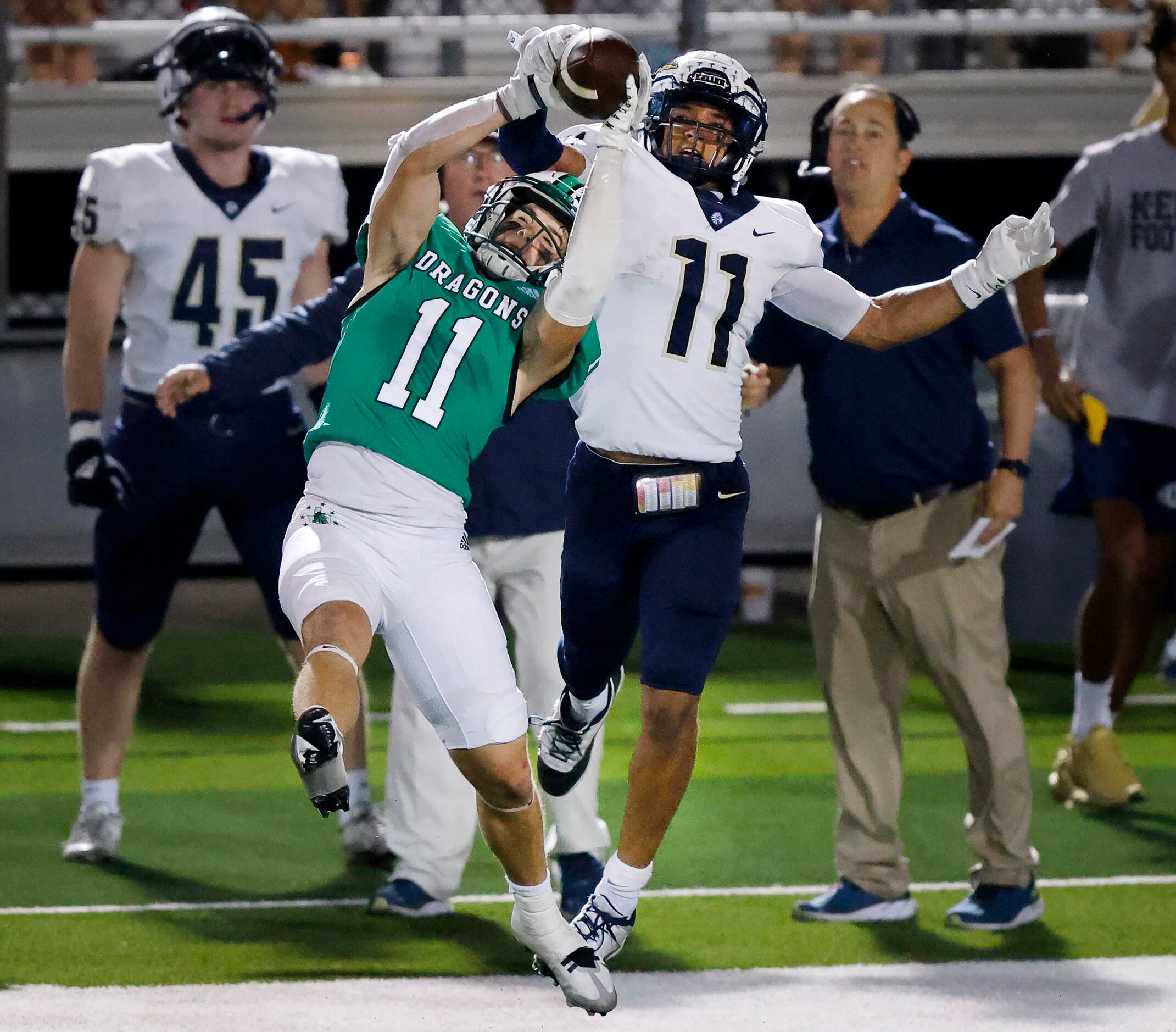 Southlake Carroll defensive back J David Sparks (11) attempts to intercept a pass intended...
