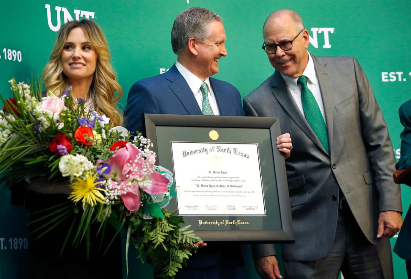 Amanda and G. Brint Ryan (center) were recognized by University of North Texas President...