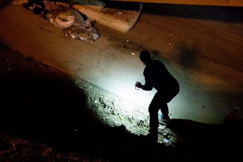 Ben Bailey looked for a homeless person under a bridge during the annual homeless count in...