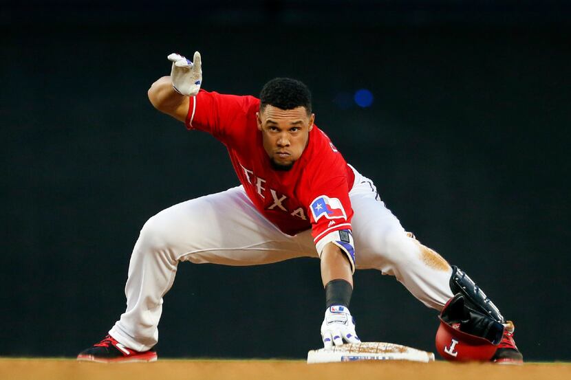 Texas Rangers' Carlos Gomez calls for time after recovering from his slide into second on a...