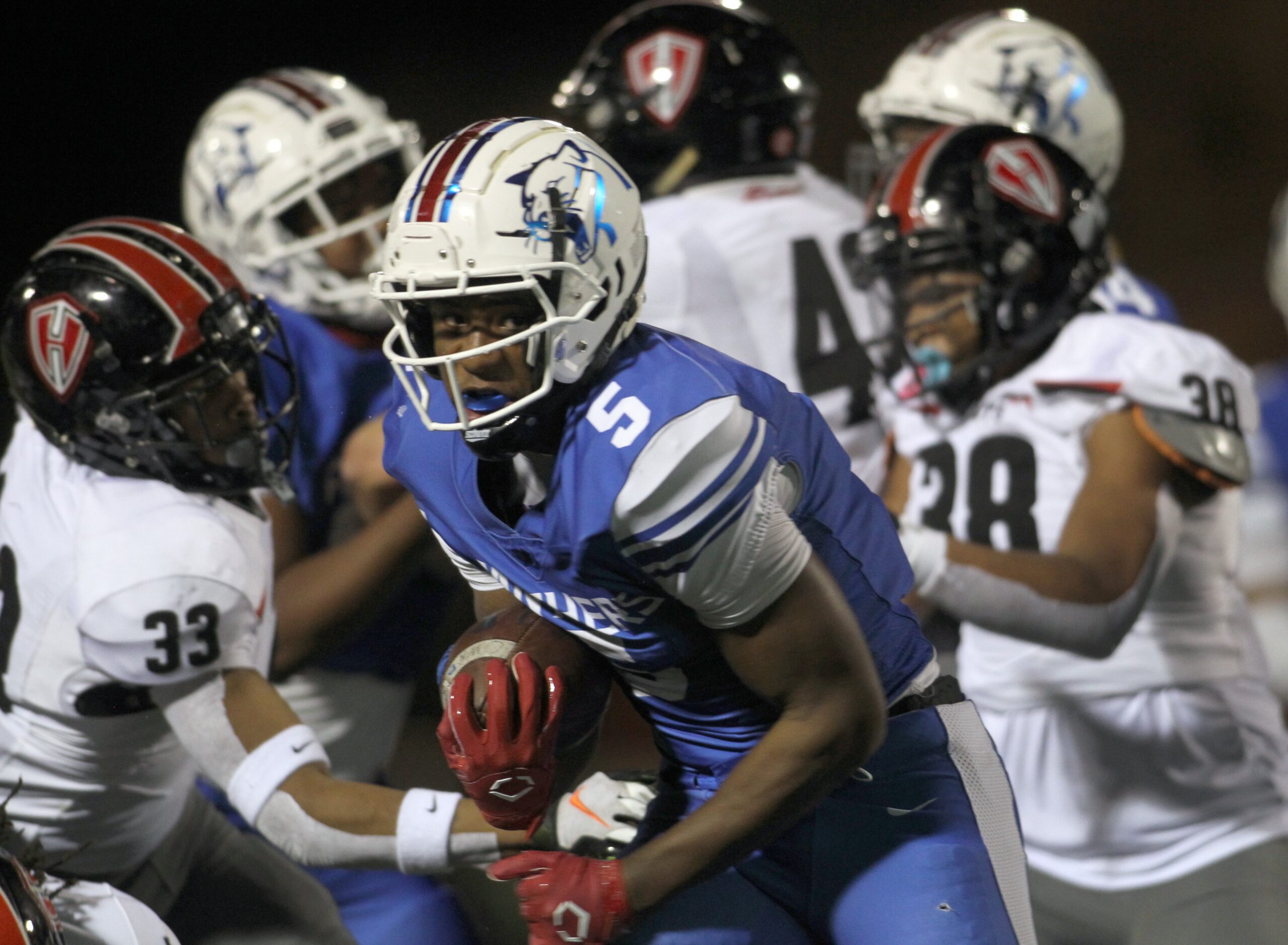 Duncanville running back Malachi Medlock (5) busts up the middle for a rushing touchdown...