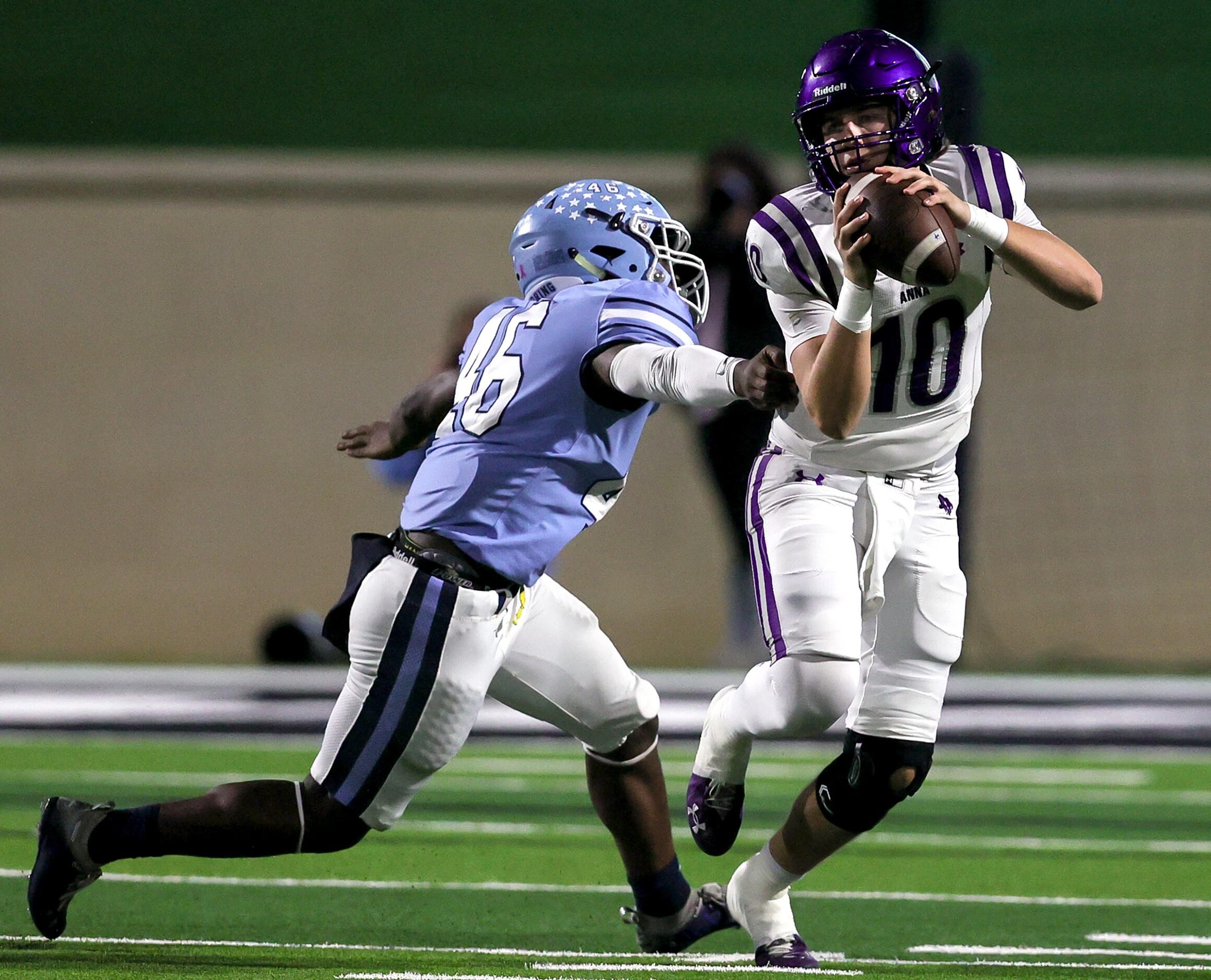 Anna quarterback Evan Bullock (10) tries to avoid getting sacked by China Spring defensive...