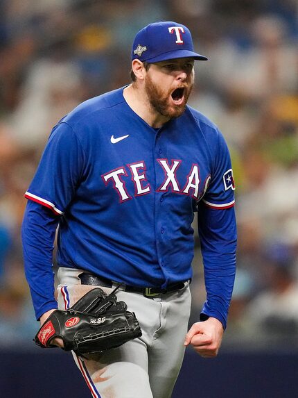 Texas Rangers starting pitcher Jordan Montgomery reacts after striking out Tampa Bay Rays...