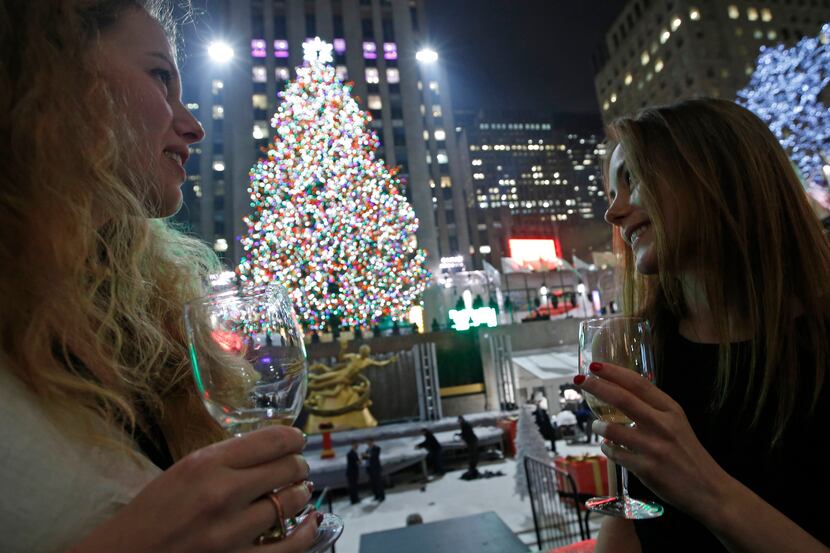 In this Dec. 4, 2013 photo, Anna Ladner, left, and Vanja Ojes Dahlberg sip Champagne in...