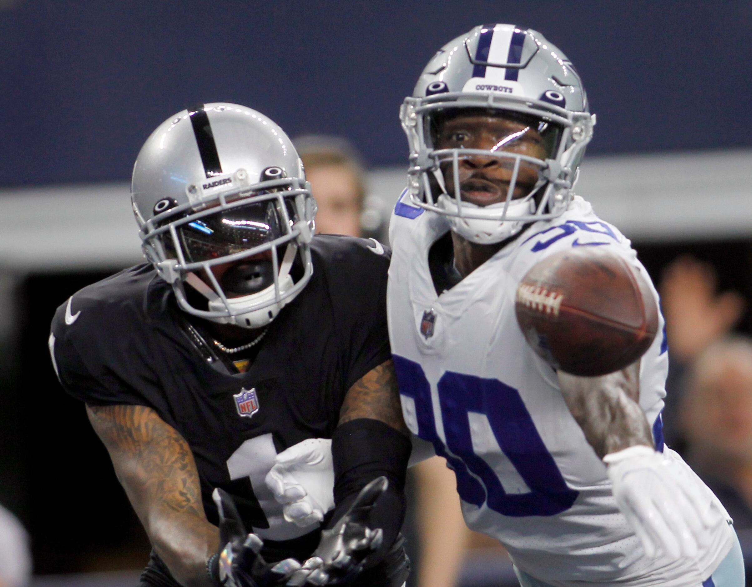 Dallas Cowboys cornerback Anthony Brown (30), right, deflects a pass in the end zone...