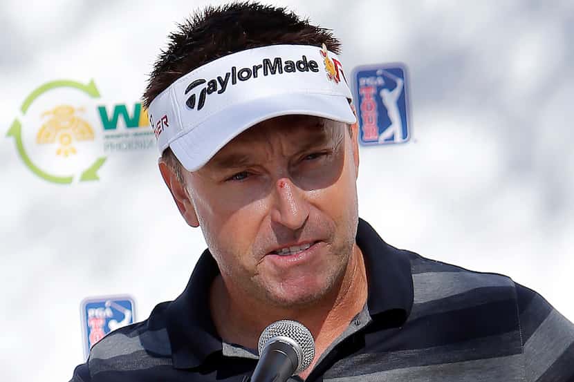 Robert Allenby, of Australia, talks to the media at a practice round for the Phoenix Open...