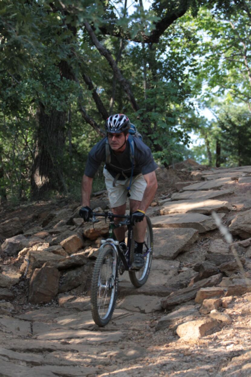 Fran Desautels navigates a rock hill on Murrell Park's Northshore Trail.