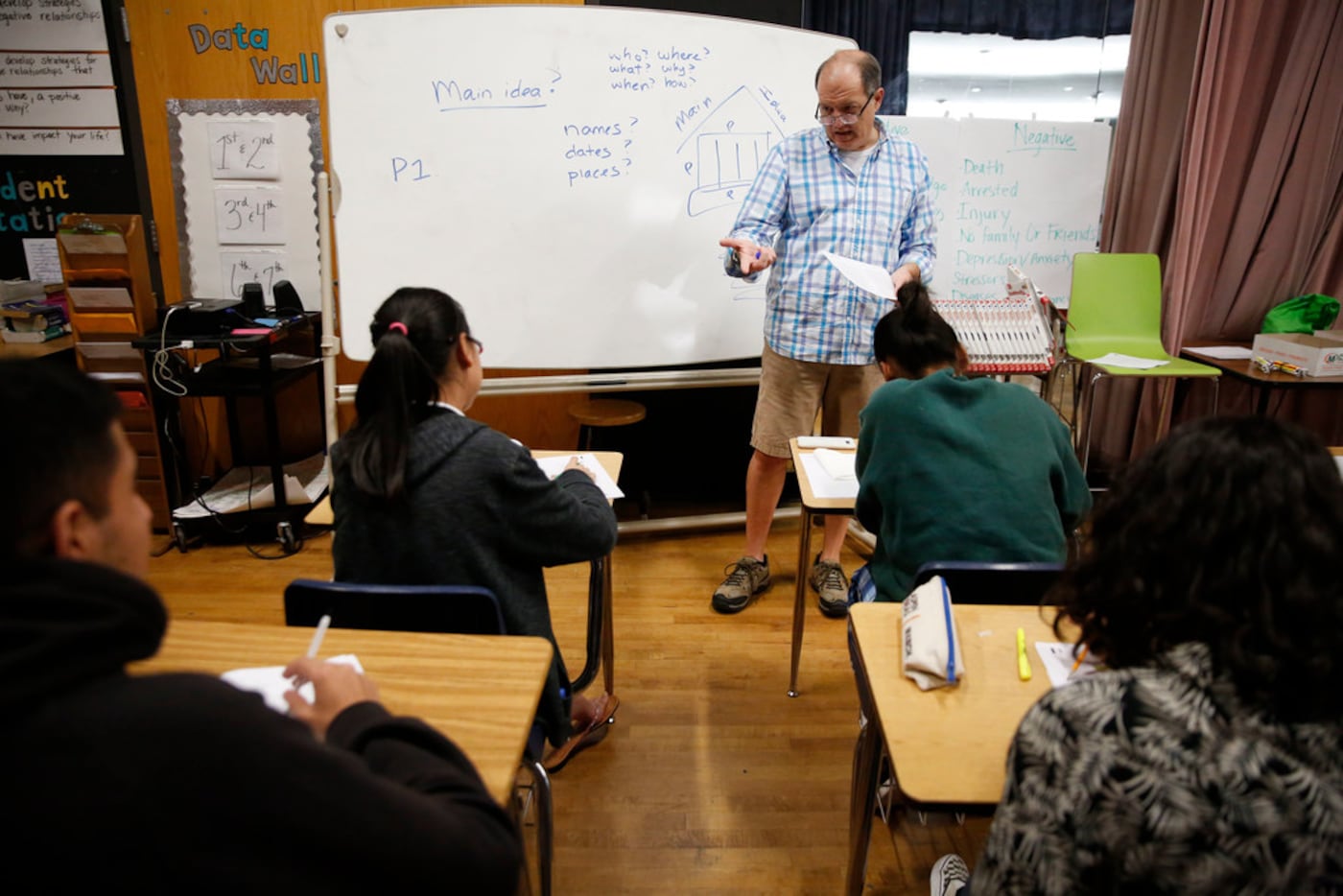 Volunteer Hal Karp teaches an SAT prep class for high school Eagle Scholars at Sam Tasby...
