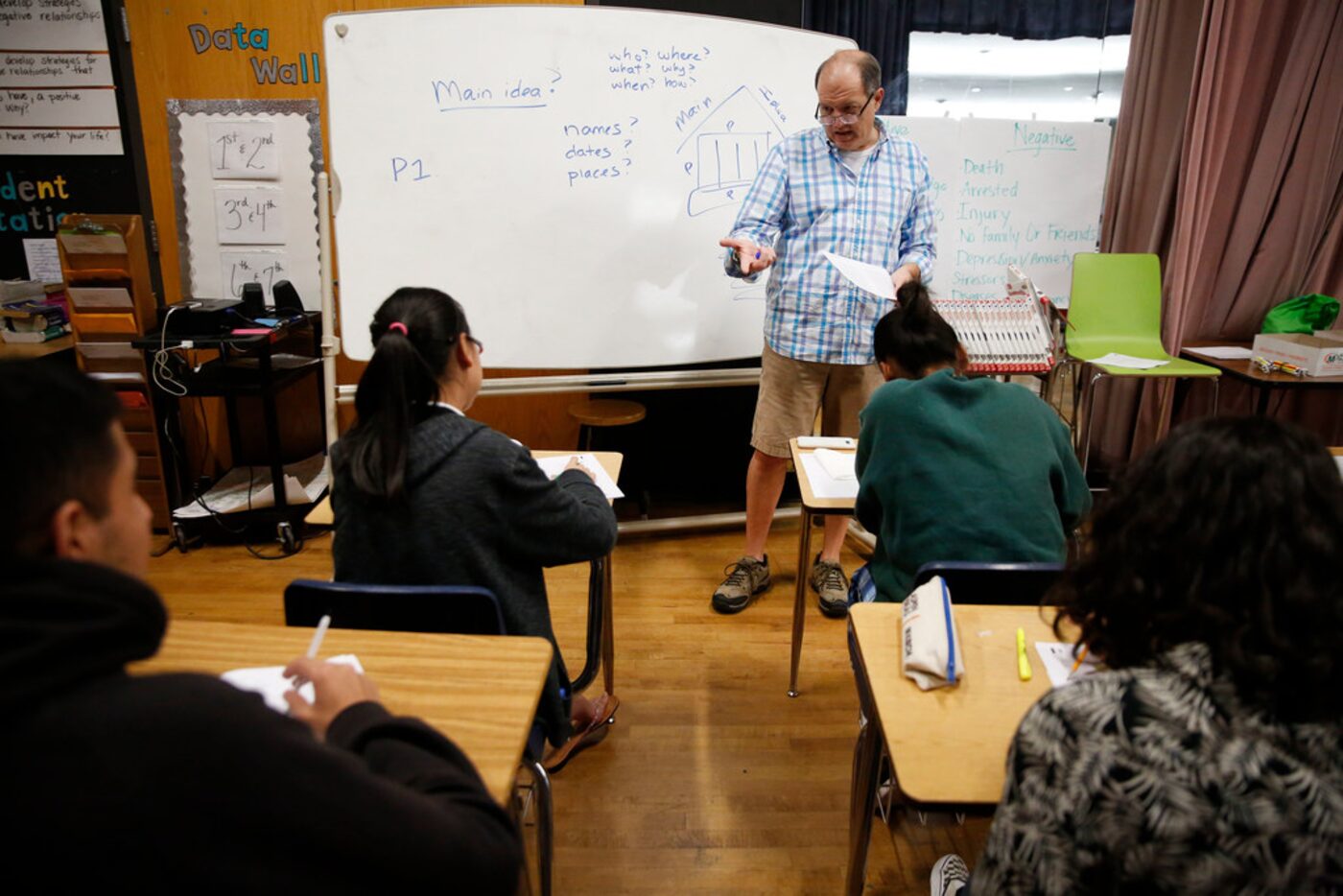 Volunteer Hal Karp teaches an SAT prep class for high school Eagle Scholars at Sam Tasby...