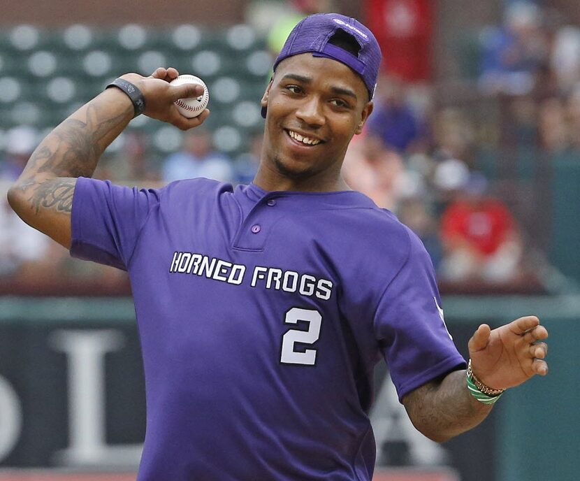 TCU quarterback Trevone Boykin throws out the ceremonial first pitch before the Arizona...