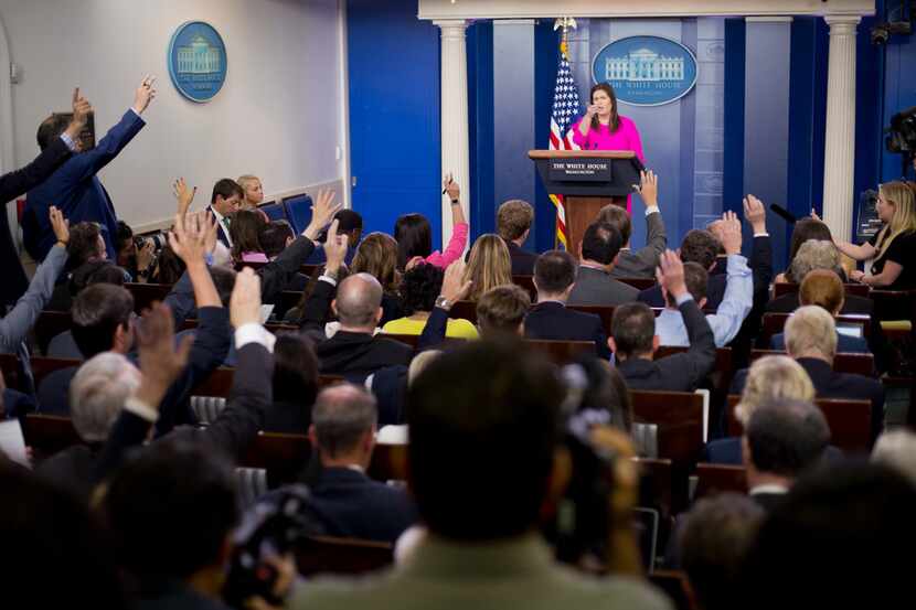 White House press secretary Sarah Huckabee Sanders gestures while speaking to the media...