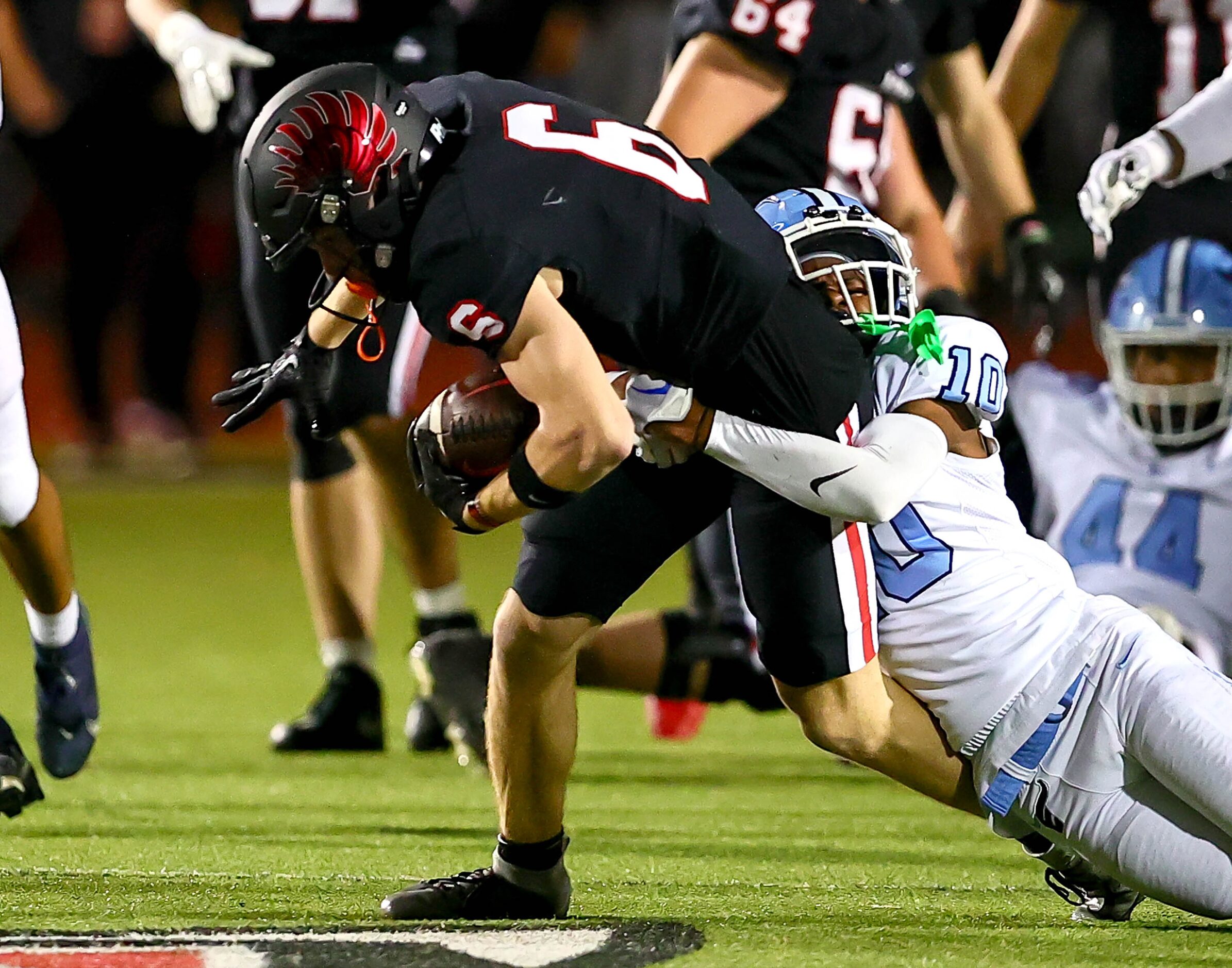 Argyle wide receiver Lane Stewart (6) drags Frisco Emerson defensive Kennedy Breedlove (10)...