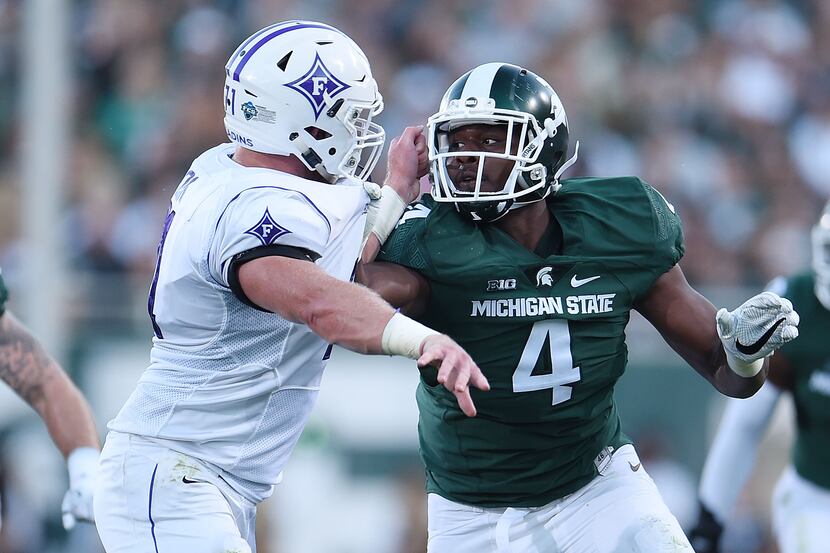 EAST LANSING, MI - SEPTEMBER 02:  Malik McDowell #4 of the Michigan State Spartans rushes...