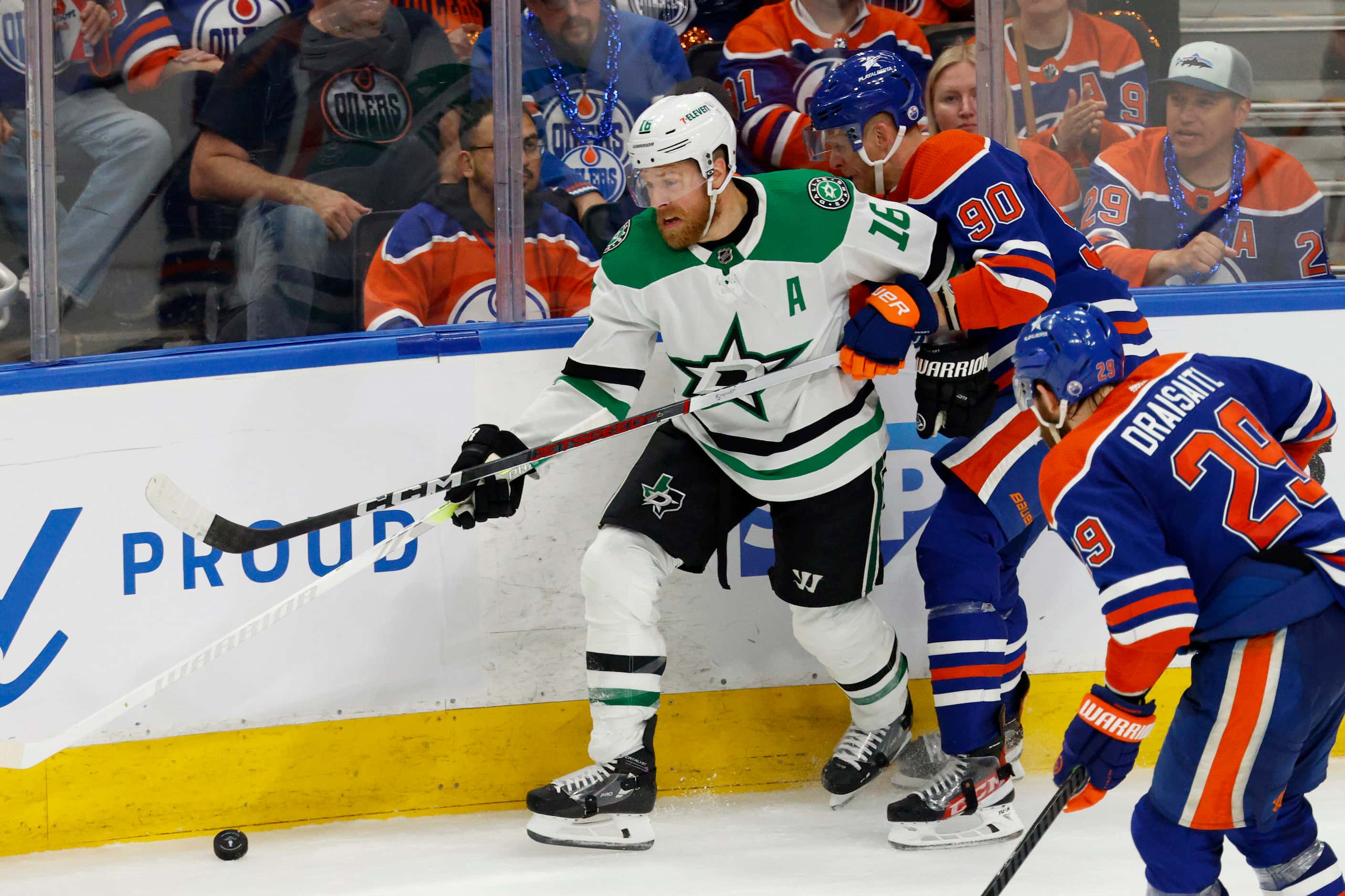 Dallas Stars center Joe Pavelski (16) battles against the boards for the puck with Edmonton...