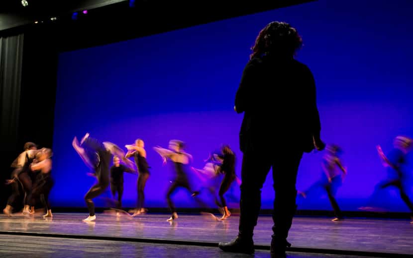 Choreographer Bridget L. Moore watches Southern Methodist University students rehearse her...