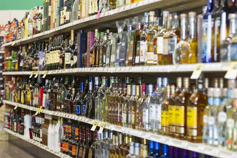 Shelves are filled with bottles of liquor at a 21st Amendment liquor store in Carmel, Ind.,...