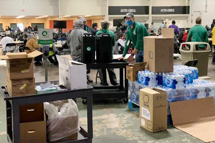 The scene inside the Fair Park Automobile Building on Feb. 3 as homeless advocates prepared...