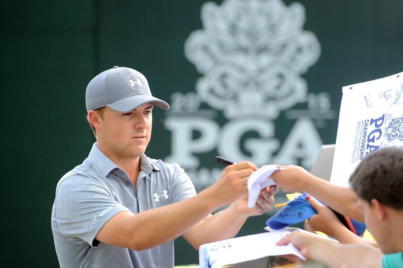Aug 10, 2015; Sheboygan, WI, USA; Jordan Spieth signs autographs during a practice round for...