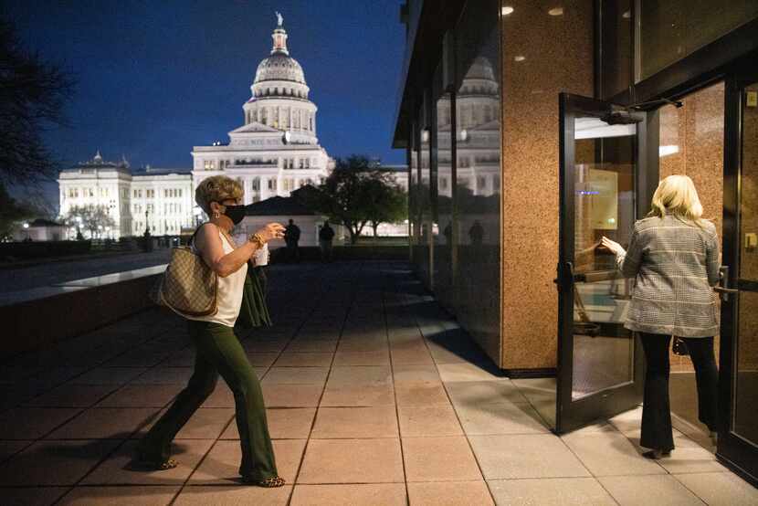 Cheryl Pangburn holds the door for Shannon Dion as they enter Austin's John H. Reagan State...