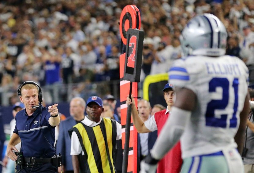 Dallas Cowboys head coach Jason Garrett points to running back Ezekiel Elliott (21) after a...