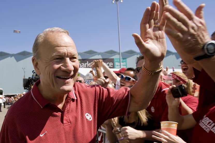 Former Oklahoma coach Barry Switzer meets fans before the Texas OU game at the Cotton Bowl...