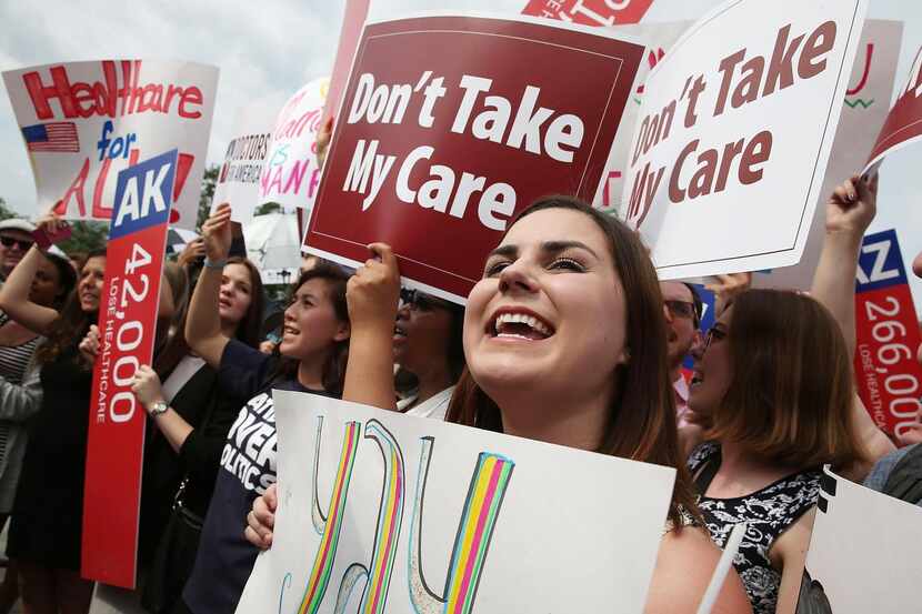 
Health care law supporters cheered in front of the Supreme Court on Thursday after the...