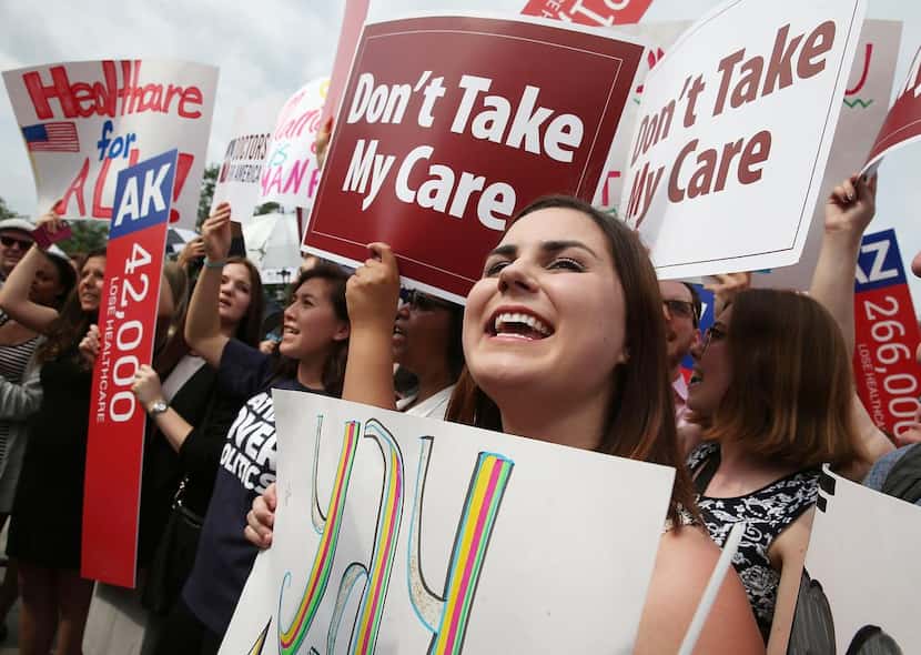 
Health care law supporters cheered in front of the Supreme Court on Thursday after the...