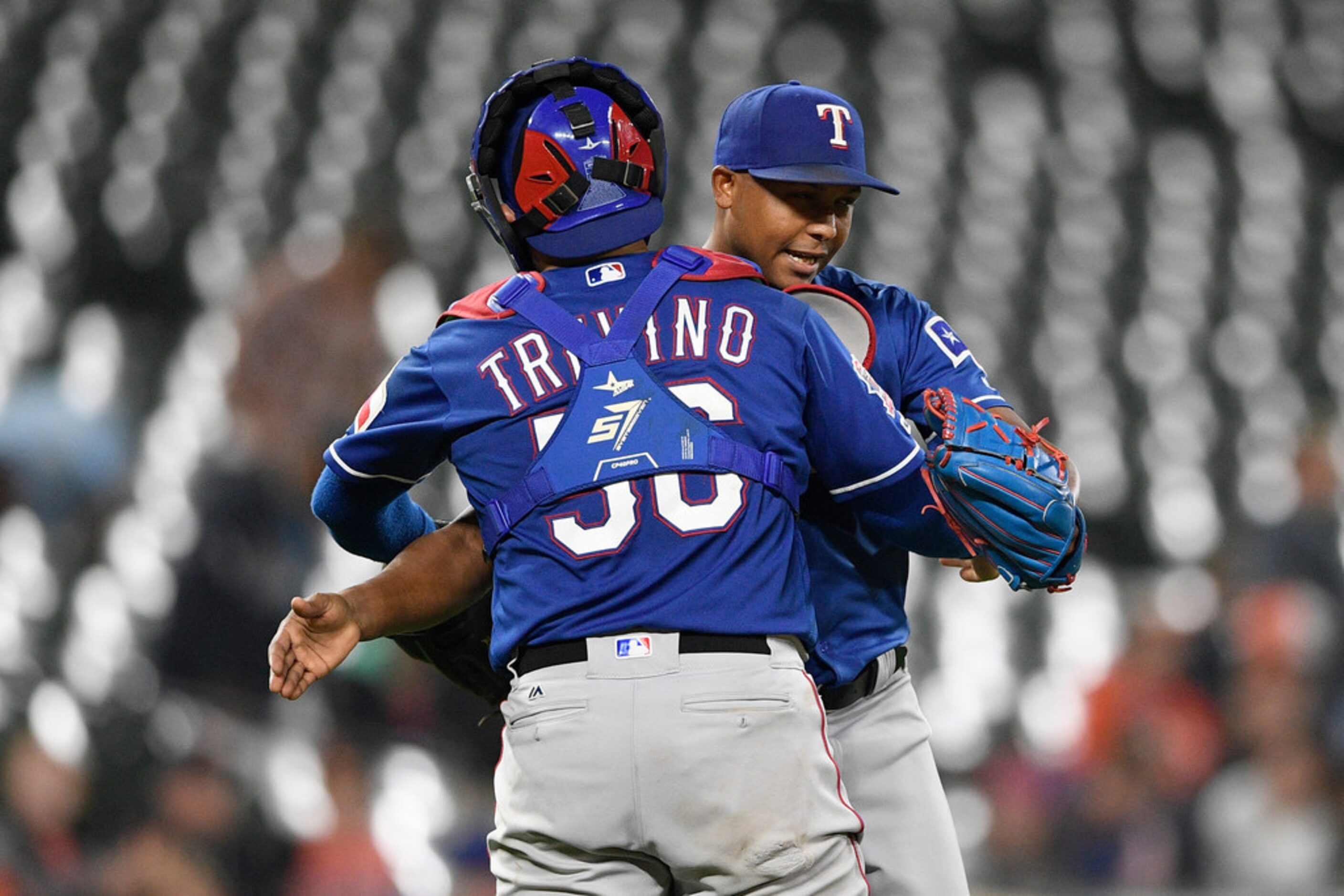 Texas Rangers' Jose Leclerc, right, celebrates with Jose Trevino after a baseball game...