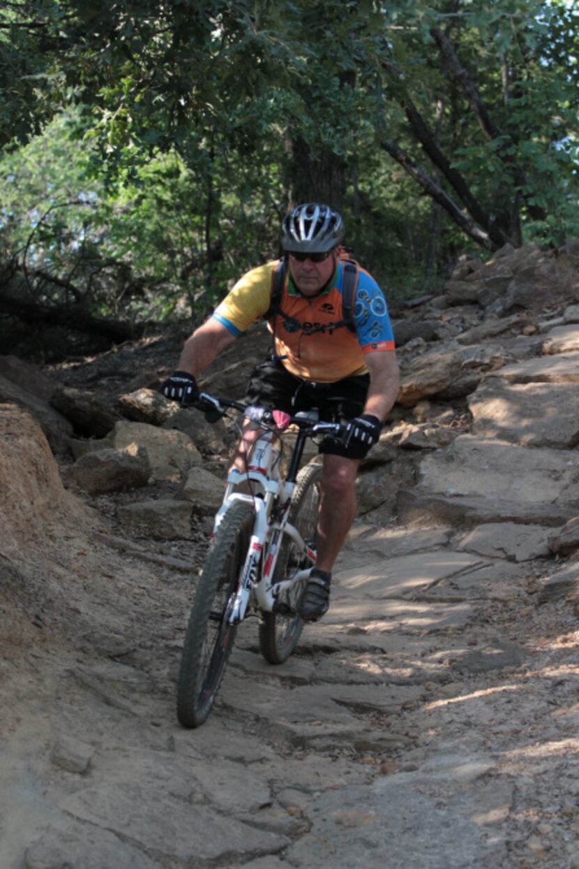 David Drury, a trail steward for the Dallas Off Road Bicycle Association, considers the...