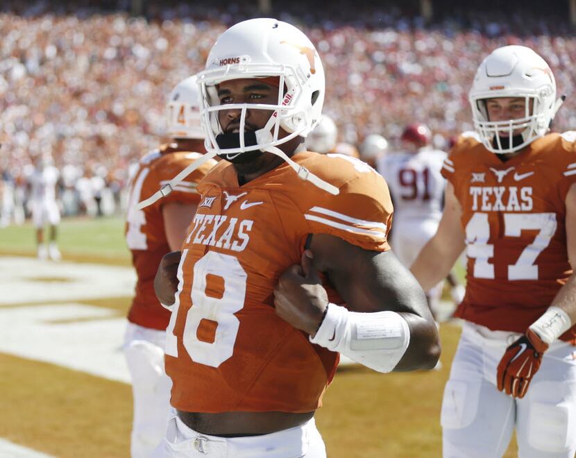 Texas Longhorns quarterback Tyrone Swoopes (18) celebrates after he scored a 3-yard rushing...