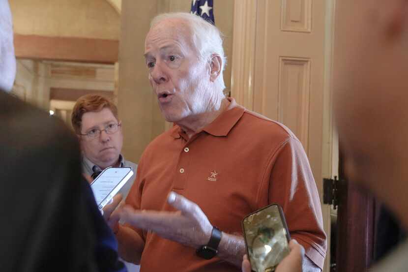 Sen. John Cornyn, R-Texas, speaks with reporters at the U.S. Capitol, on Monday, Sept. 11,...