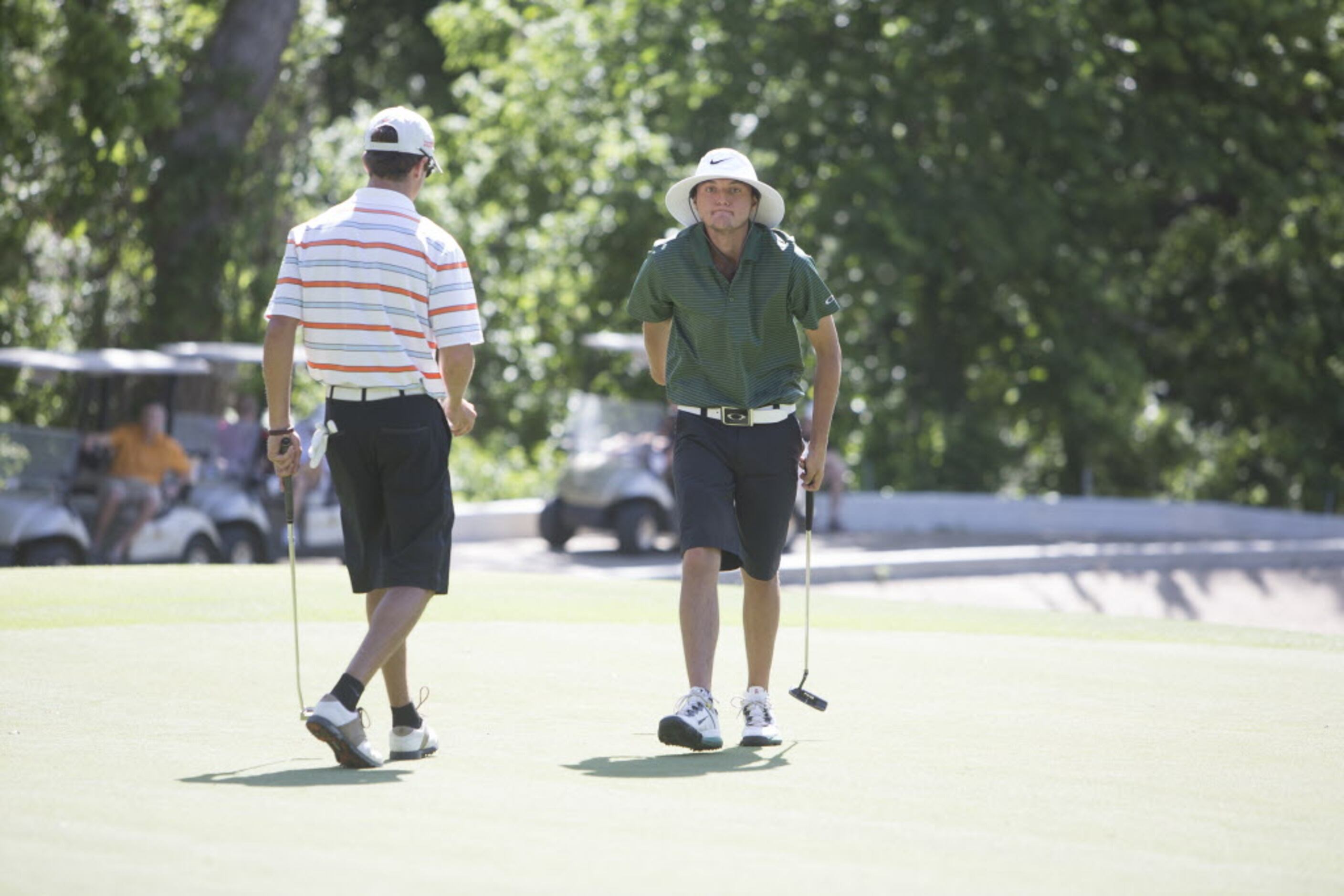 Southlake Carroll freshman Willie Hammond, left, reacts to a missed putt at the UIL 5A State...