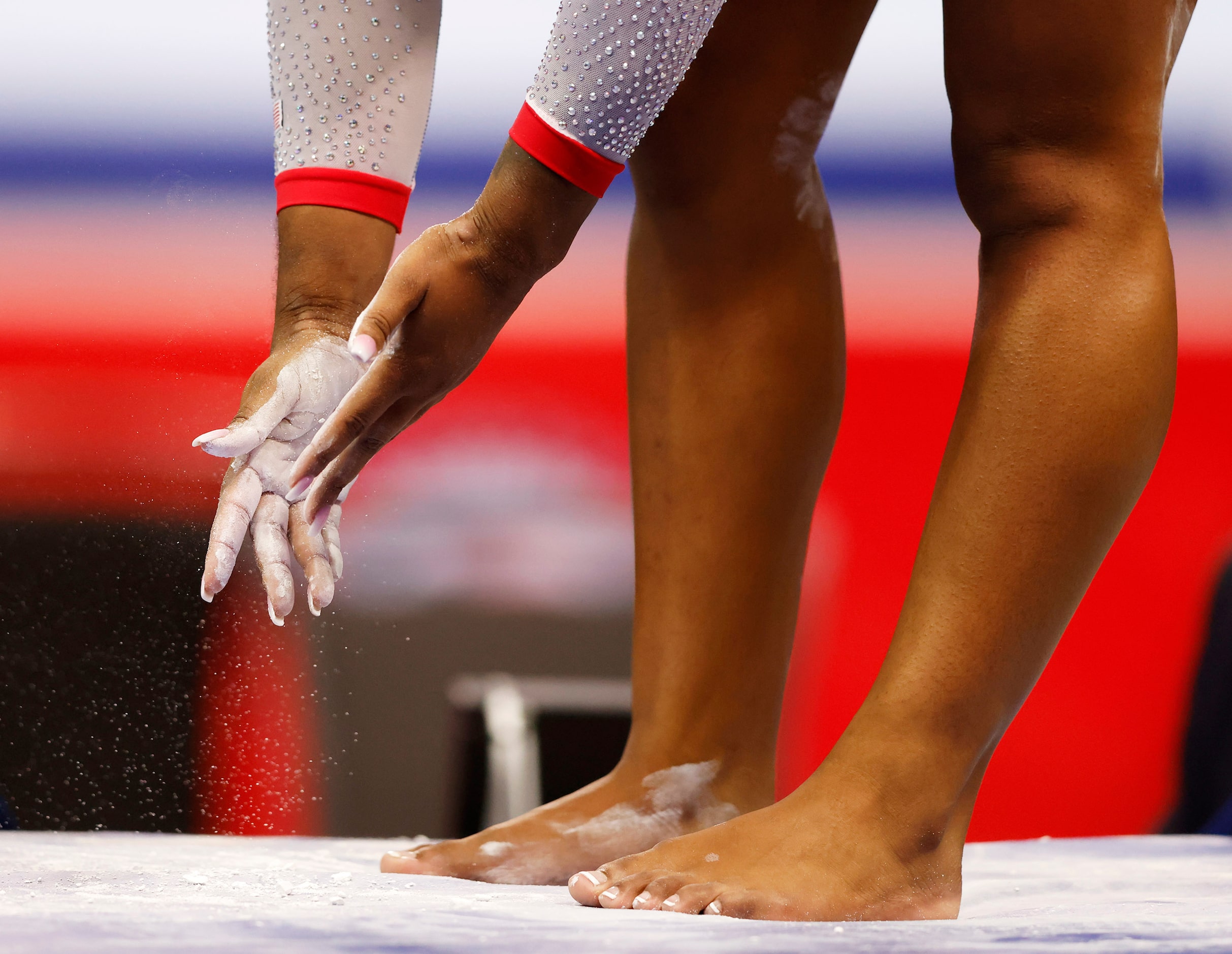 Jordan Chiles of World Champions applies chalk to her body before competing in balance beam...