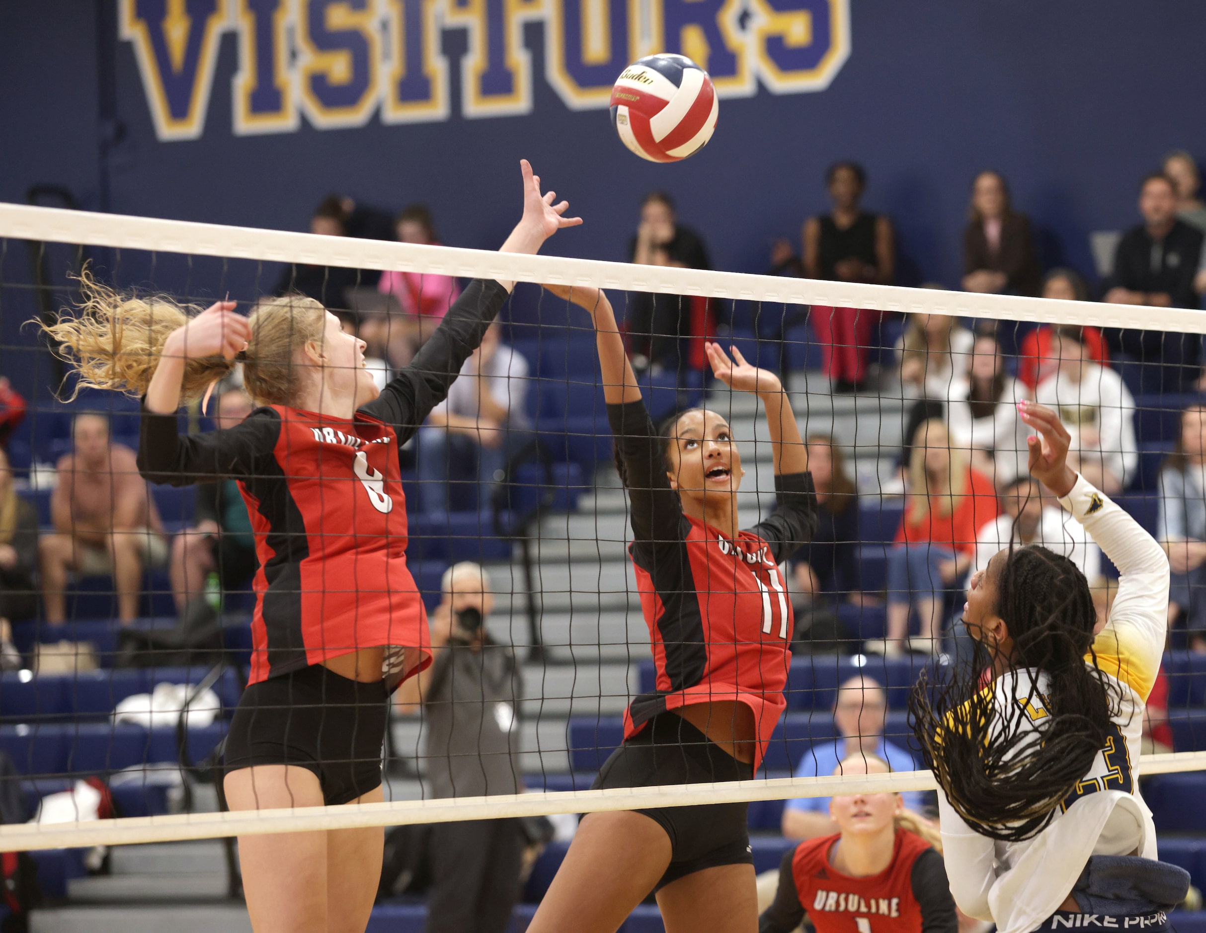 Ursuline players #8 Katie Rakoski and #11 Mara Hall try to control the ball during the...