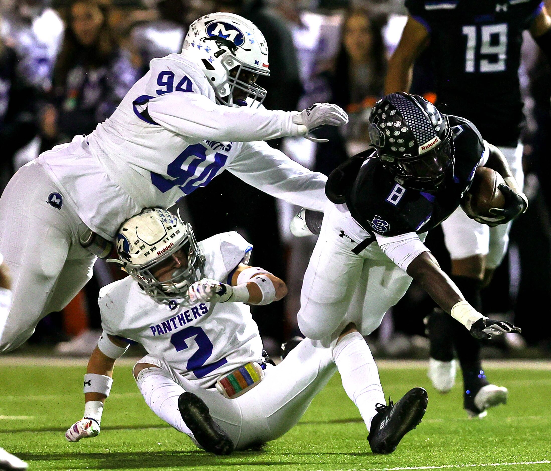 Mansfield Summit running back Keon Hobbs (8) drives forward for a first down as he is...