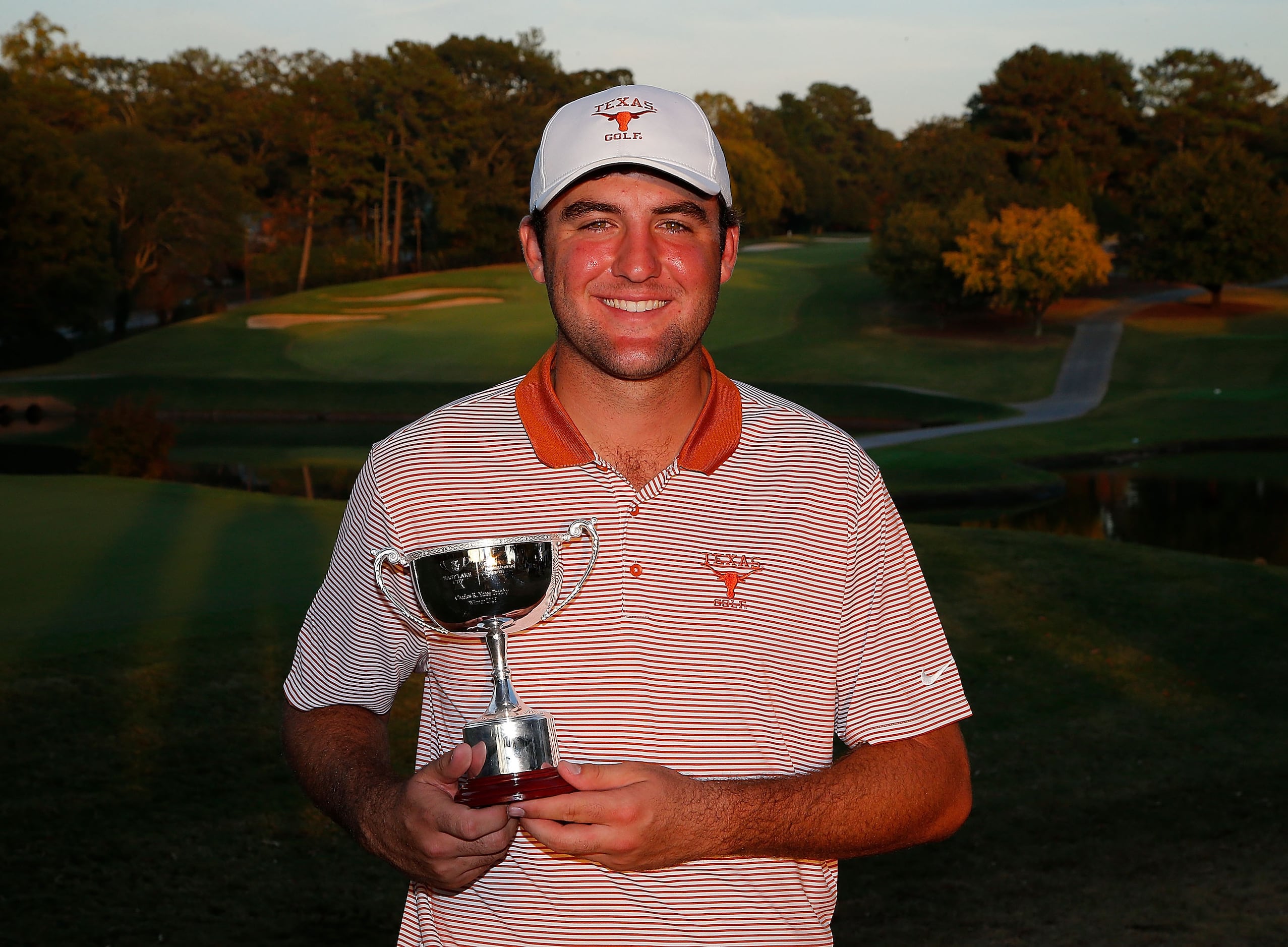 Scottie Scheffler of Texas poses with the trophy after his win during day 1 of the 2016 East...