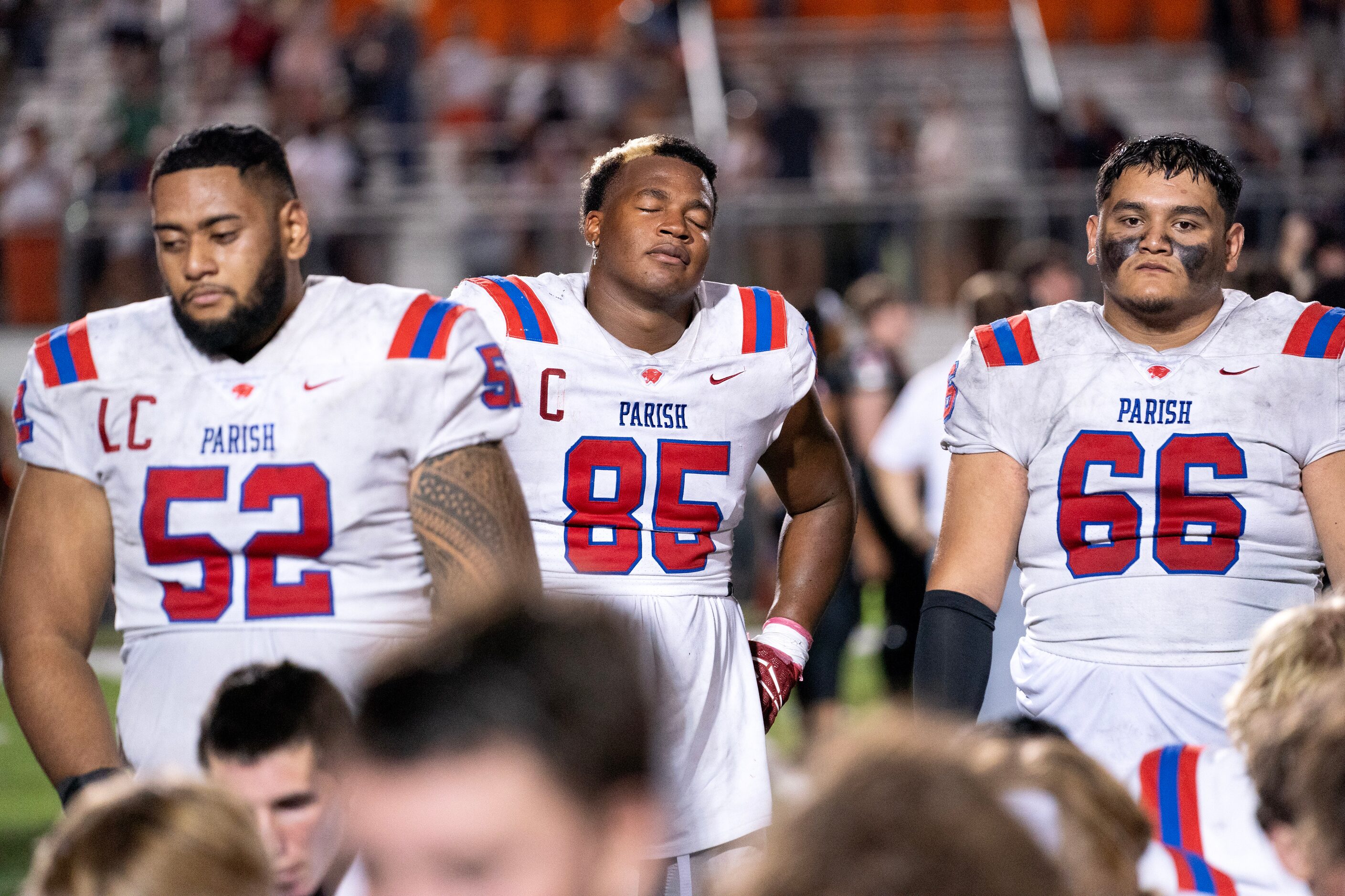 Parish Episcopal senior linemen Sam Liu (52), Caleb Mitchell Irving (85) and Jacob Pequeno...