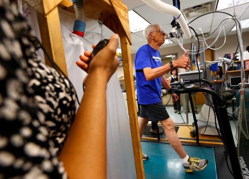 Richard Rahn gives the thumbs-up during a treadmill stress test at the Institute for...