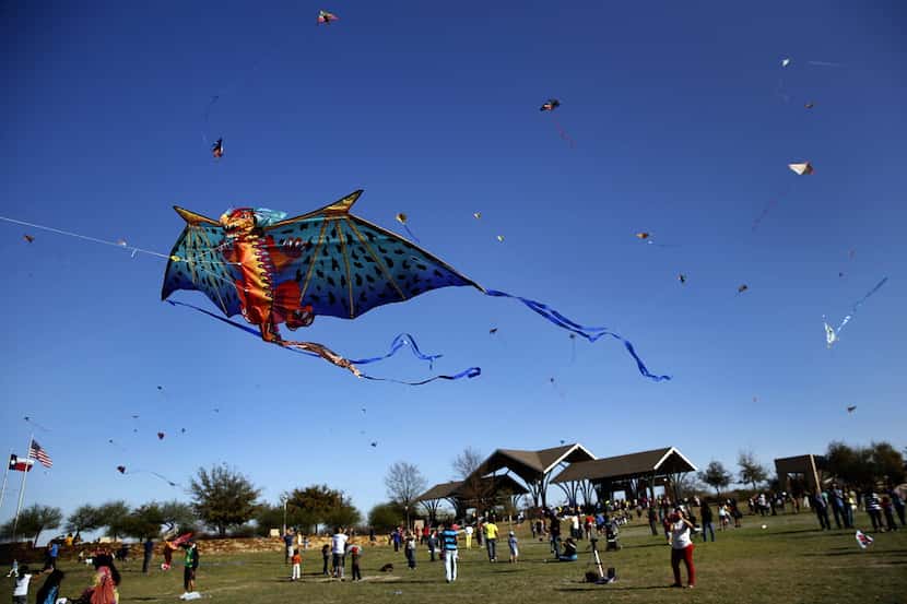 A dragon kite takes flight with several others at the 11th Annual Kite Flying Festival...