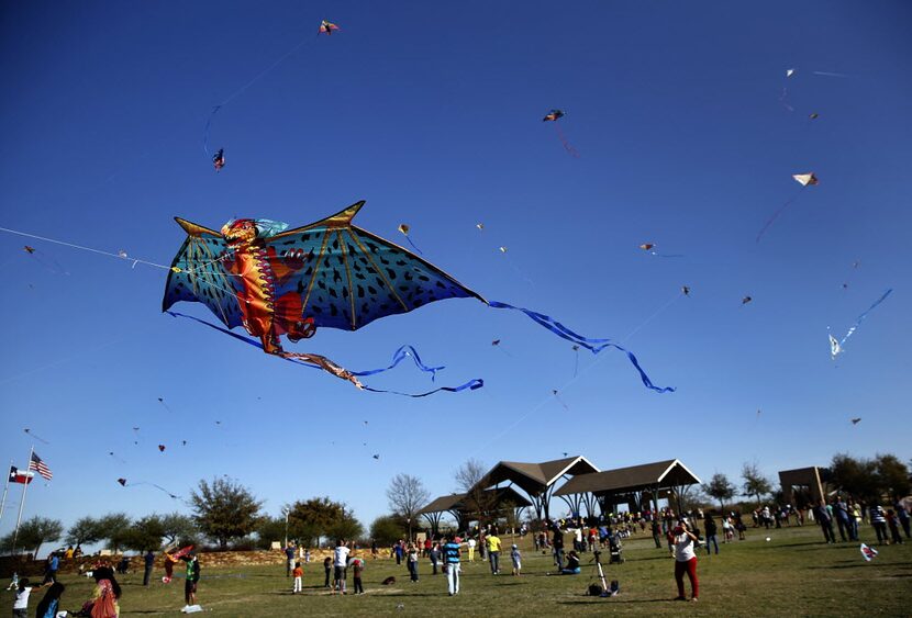 A dragon kite takes flight with several others at the 11th Annual Kite Flying Festival...