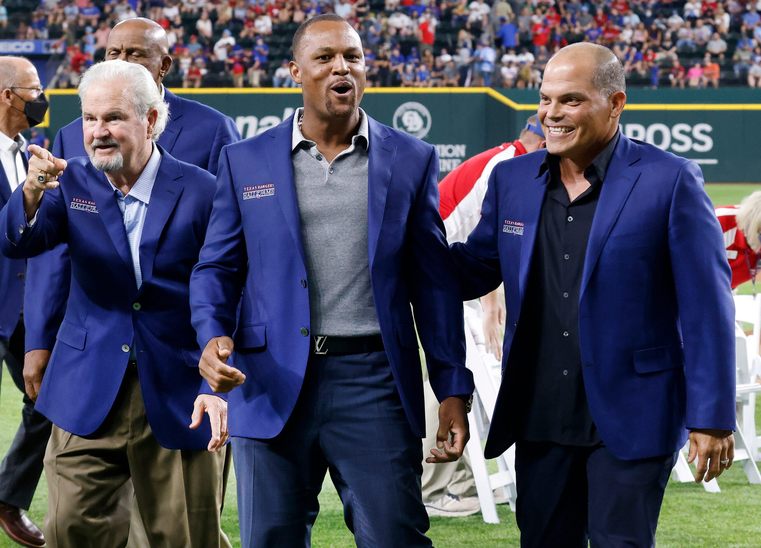 Former Texas Rangers third baseman Adrian Beltre (center) is congratulated by former Rangers...