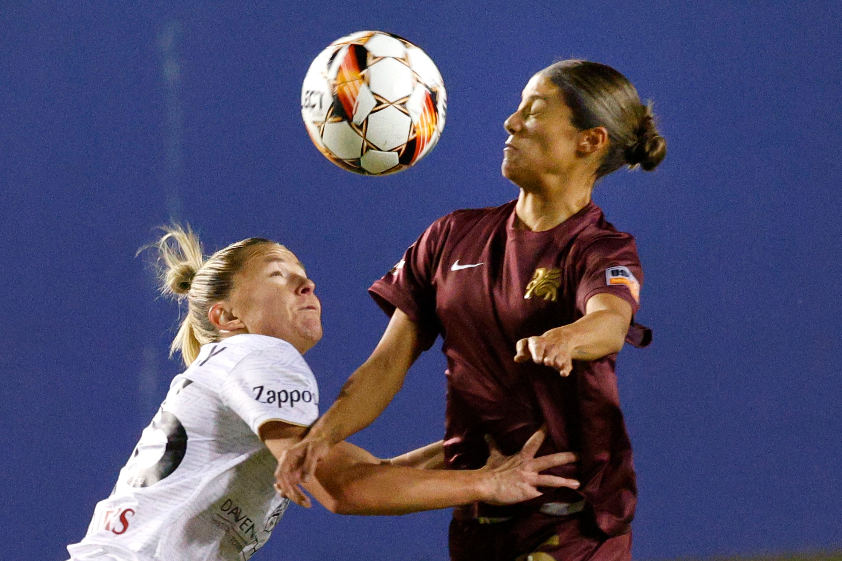 Spokane Zephyr midfielder  Katie Murray and Dallas Trinity midfielder Samantha Meza compete...