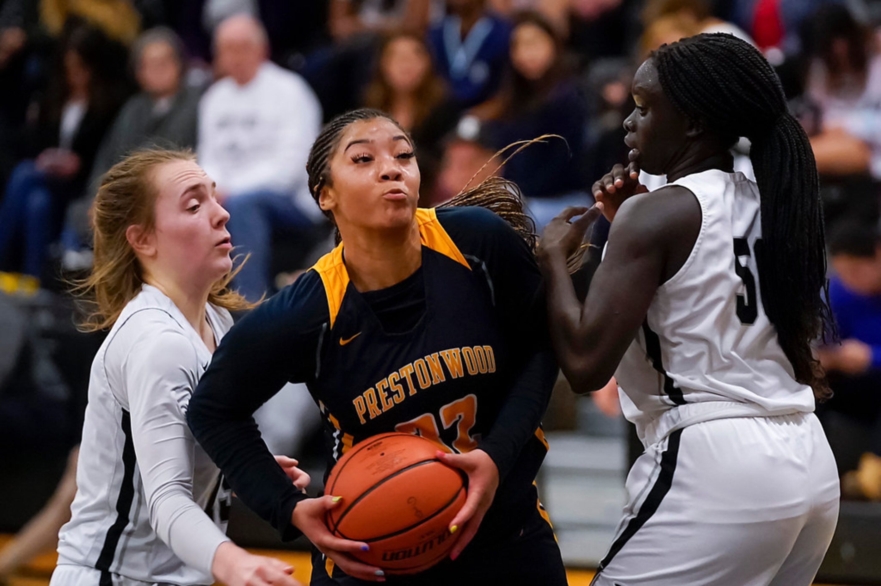 Prestonwood Christian guard Jordan Webster (32) tries to drive between Bishop Lynch guard...