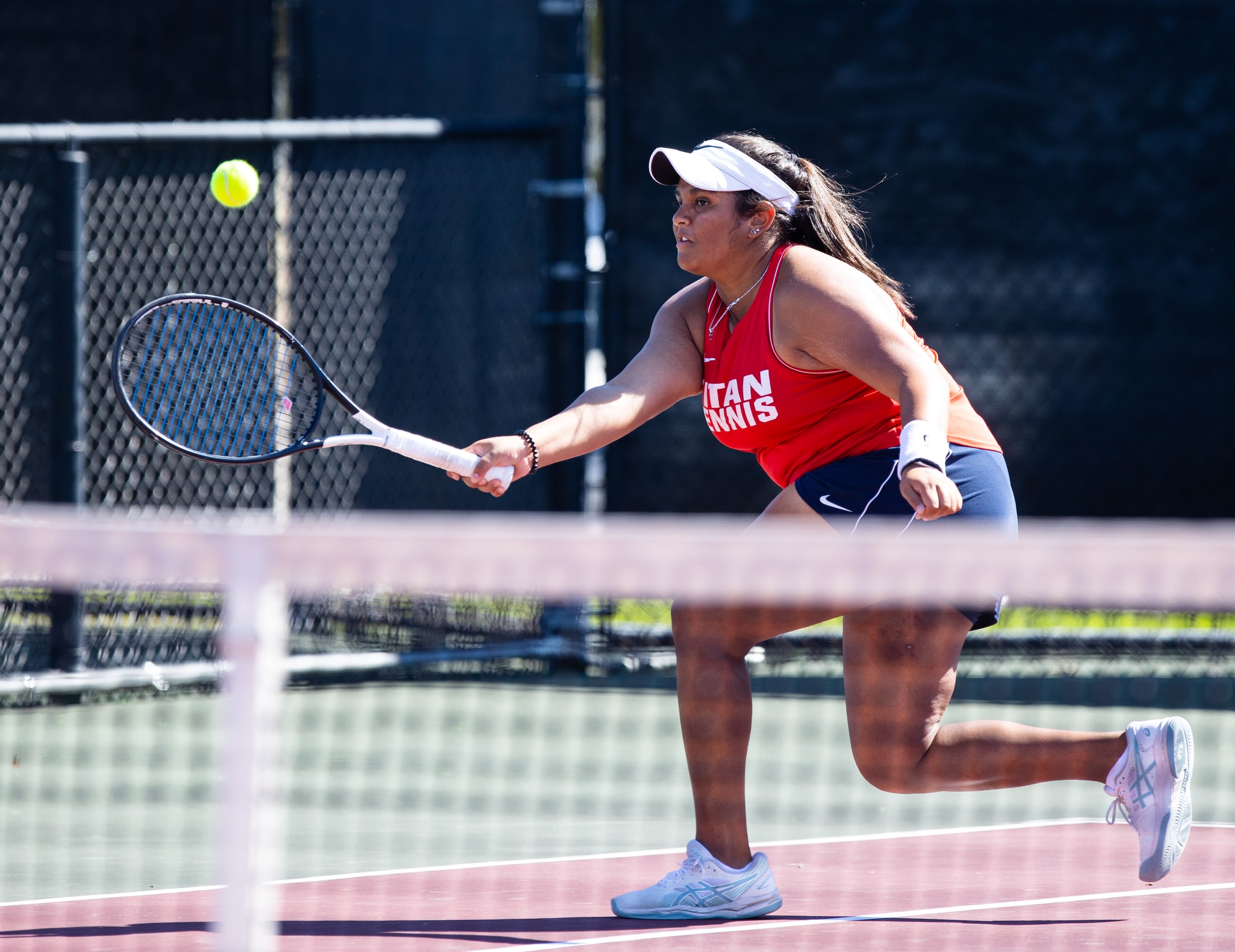 Frisco Centennial’s Aashikha Basappa returns a shot during a mixed doubles match with...