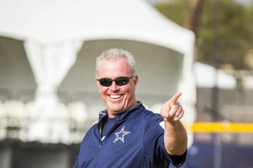 Dallas Cowboys COO Stephen Jones points toward the sidelines after during afternoon practice...