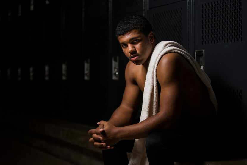 Mansfield Legacy football player Jalen Catalon poses for a portrait in the locker room on...