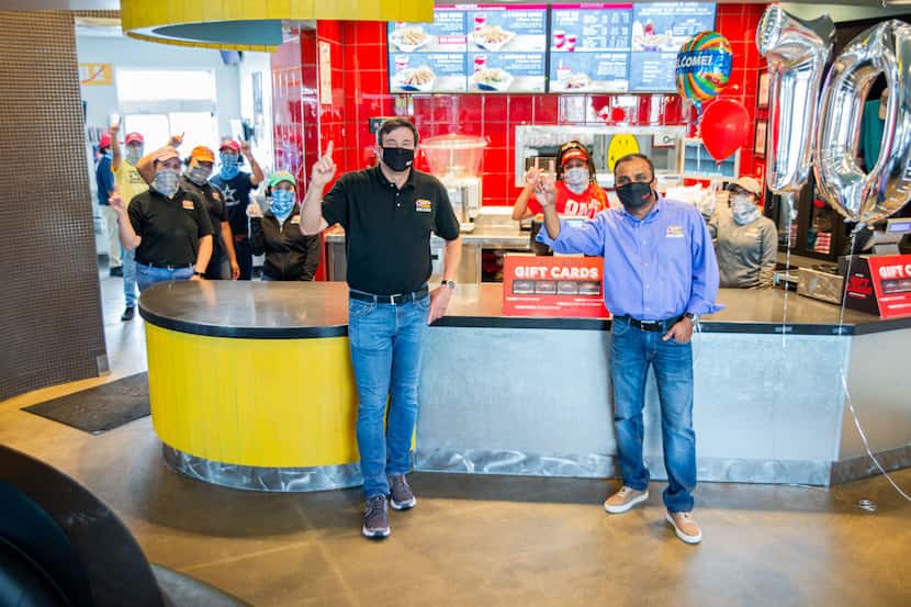 Raising Cane's Chicken Fingers co-CEOs Todd Graves, left, and AJ Kumaran are shown at one of...