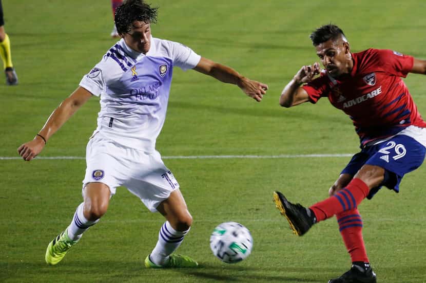 FC Dallas forward Franco Jara (29) attempts a shot in front of Orlando City defender Rodrigo...