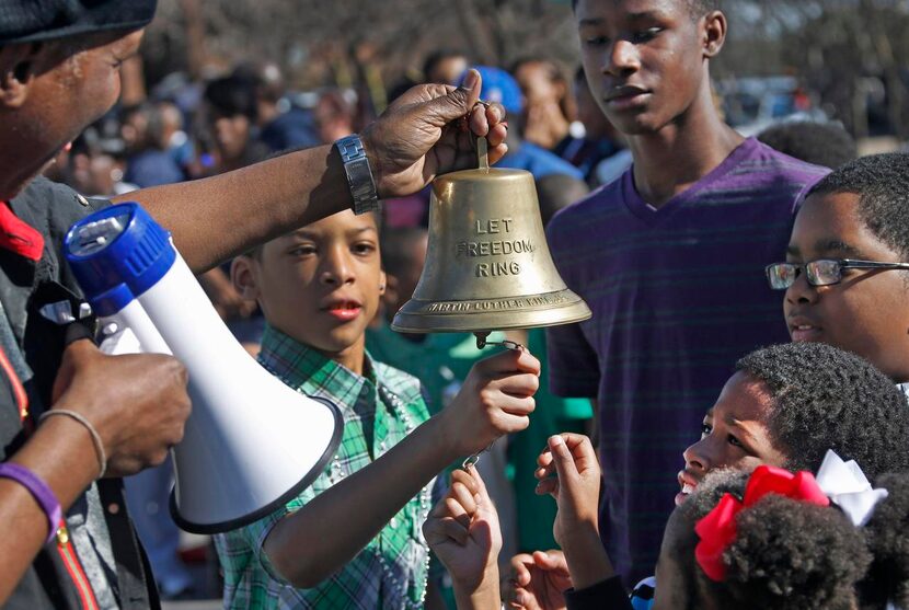 
Clarence E. Glover Jr. held the “Let Freedom Ring” bell for people of all ages to ring...