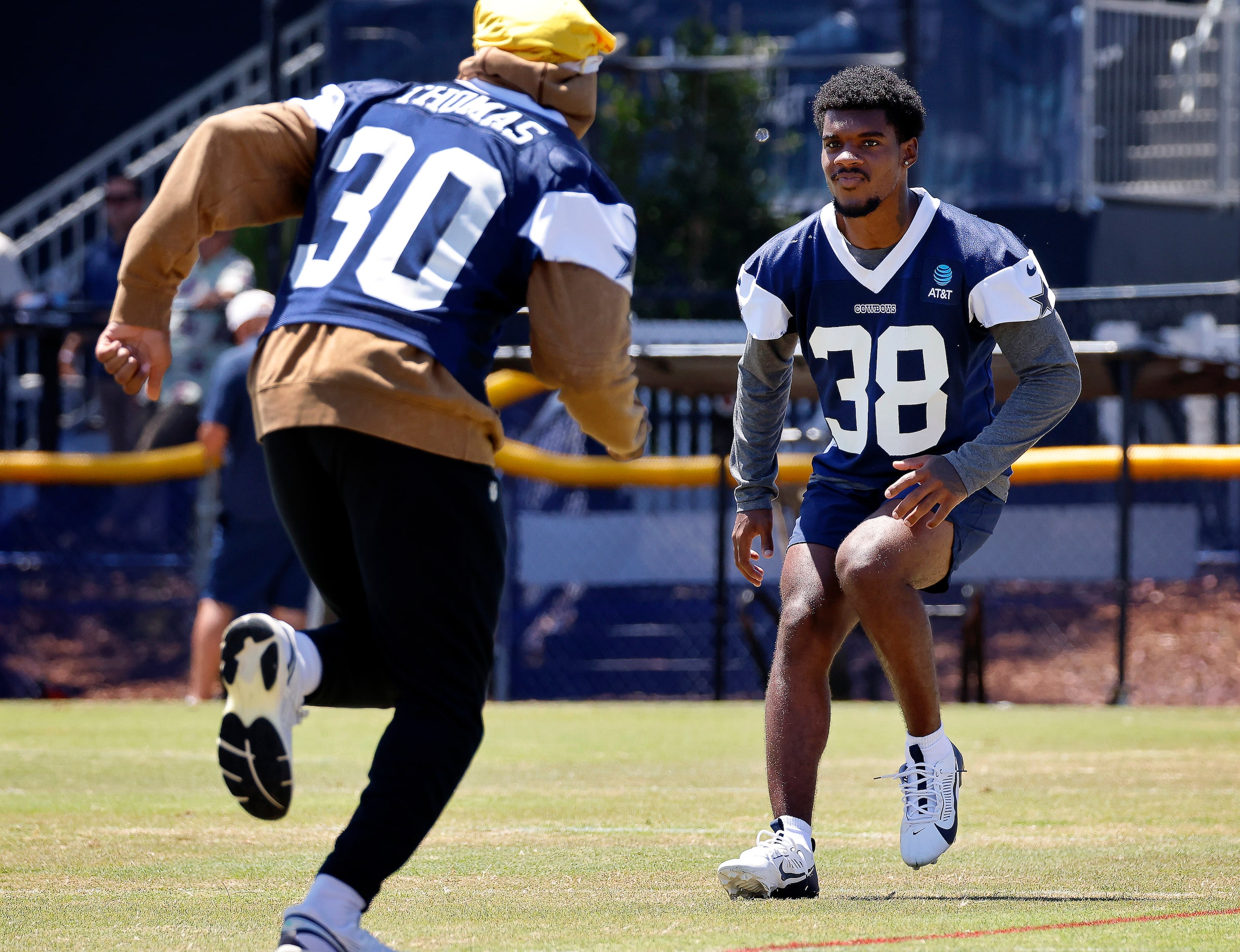 Dallas Cowboys cornerback Josh DeBerry (38) covers safety Juanyeh Thomas (30) during a mock...